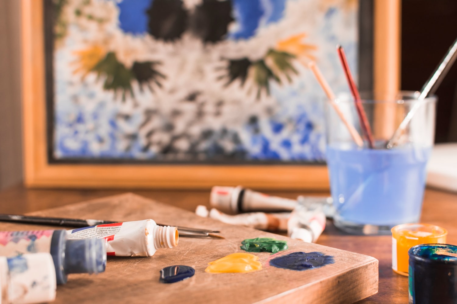 Participant creating a vibrant canvas during a Rajni Dutta Art guided workshop